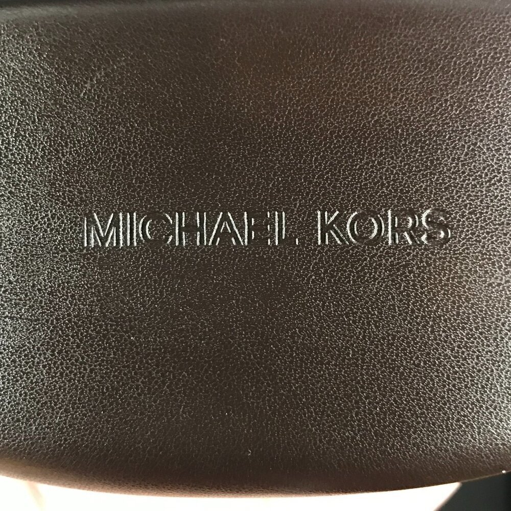 Michael Kors brown clamshell hard sided case.  Eye wear, sun glasses, glasses